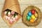 Colorful easter eggs in nest, pink beautiful tulips, mothers day