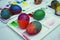 Colorful easter eggs painting activity with color tray background, fun event concept