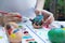 Colorful easter eggs painting activity with color tray background, fun event for kid concept