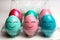 Colorful easter eggs in plastic egg case pack with happy emoji faces