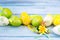 Colorful Easter eggs and rabbit statuette on a wooden background