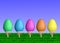 Colorful Easter Eggs on Sticks in Grass