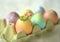 Colorful Easter Eggs with a Tiny Flower in a Cracked Shell