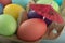 Colorful Easter eggs under umbrella in a box