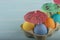 Colorful Easter eggs under umbrellas in a carton