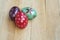 Colorful Eater eggs on wooden table. Easter background.