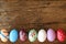 Colorful Eater eggs on wooden table. Easter background. Copy space