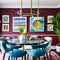 A colorful and eclectic dining room with mix-and-match chairs, a gallery wall of artwork, and a bold patterned rug2, Generative