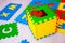 Colorful educational rugs for kids jigsaw puzzles, which are fashionable to collect in the boxes with the English alphabet, teach