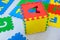 Colorful educational rugs for kids jigsaw puzzles, which are fashionable to collect in the boxes with the English alphabet, teach