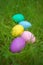 Colorful eggs on fresh springtime grass