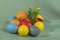 Colorful eggs, symbolizing Easter, on a colorful background and flowers