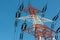 Colorful electricity pillar against blue sky