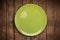 Colorful empty plate on grungy background table