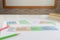 Colorful English grammar sheets on white table in classroom