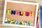 Colorful ENGLISH word alphabet on a pin board background ,English language learning concept