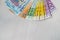Colorful euro banknotes in fan on wooden table