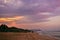 A colorful evening in the beach of goa with trail in sand