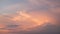 Colorful evening landscape with soft pastel coloured cloudscape on watercolor tinted sunset sky. Abstract nature