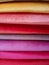 Colorful fabric stacks detail view close up