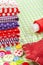 Colorful fabrics, buttons, pin cushion, thimble, spool of thread - set for sewing