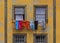 Colorful facade of a traditional house with peeling paint in the Ribeira with laundry hanging outside, Porto, Portugal