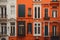 Colorful facades of houses in the old town. generative ai