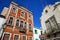 Colorful facades with wrought iron railing balconies inside the old town of Monchique, Algarve