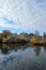 Colorful fall foliage new snow cirrocumulus clouds big sky water reflection Boise Idaho vertical