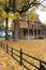 Colorful Fall image with golden leaves all over the ground outside and black wrought iron fence near church, Saratoga Springs, 201