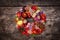 Colorful fall wreath with natural materials on wooden table, concept autumn decoration