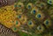 Colorful feathered tail of a male peacock as background