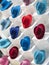 Colorful fedoras in a shop window.