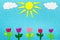 Colorful felt background with sun, clouds and tulip flowers,