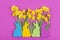 Colorful felt Easter bunnies in front of daffodils