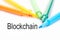 Colorful felt-tip pen and blockchain word on white background