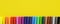 Colorful felt-tip pens on a yellow background.