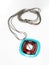 Colorful female pendant with silver string on white background