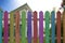 colorful fence with home background