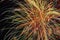 Colorful Fireworks Display at Night with Bright Streaks