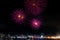 Colorful fireworks glowing in the dark night sky on the 4th of July