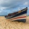 Colorful fisherman boat on beach
