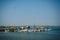 Colorful fishing boats with blue and white hulls and Indian flags on the masts, on the fishing pier in Goa. Wooden boats