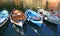 Colorful fishing boats floating in the Vernazza harbor in the Cinque Terre