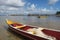 Colorful fishing boats by low tide at Ponta do Muta beach in Barra Grande, Camamu Bay, Brazil, South America