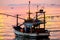 colorful flame cloud sunset fisging boat on sea and sky