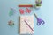 Colorful flat lay of office supplies and the words `TO DO`