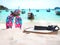 Colorful flip flops and white hat on the beach.