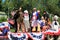 Colorful float with people dressed as historic characters, downtown Saratoga Springs,2016