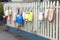 Colorful floats and buoys hanging from a fence